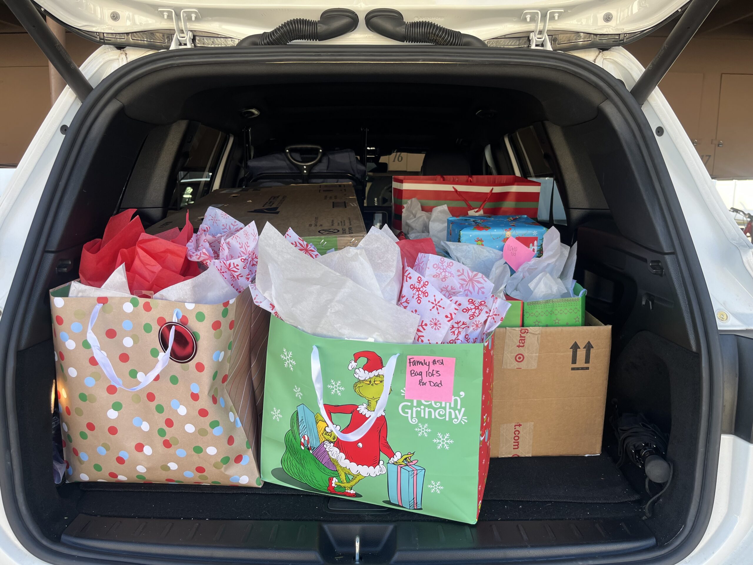 Image of gifts in the trunk of a vehicle for EVALCORP's adopt-a-family initiative